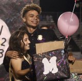 Homecoming Kings and Queen Jassni Morales and Jayden Bray Williams express surprise when picked as the school's top royalty during halftime of Lemoore's football game Friday night.